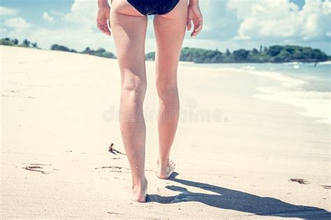 Vacation Concept Close Up Of Female Legs Walking By The Beach Of