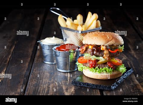 Large Hamburger With Fries Mayonnaise And Ketchup Stock Photo Alamy