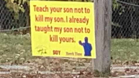 Teach Your Son Not To Kill My Son Signs Pop Up Around Town