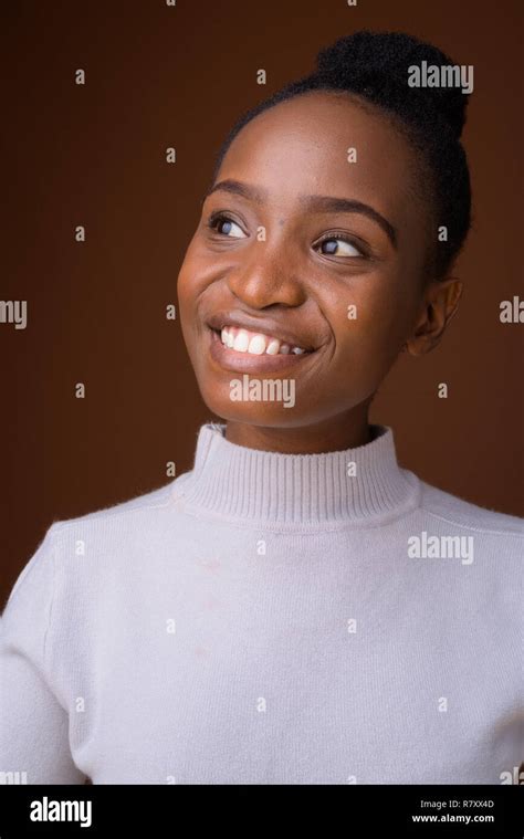 Face Of Happy Young Beautiful African Woman Smiling While Thinking