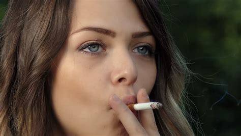 Stockvideo Von Beautiful Young Blonde Woman Smoking Cigarette