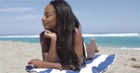 Black Woman Lying On Beach And Looking Away Stock Video Dashek