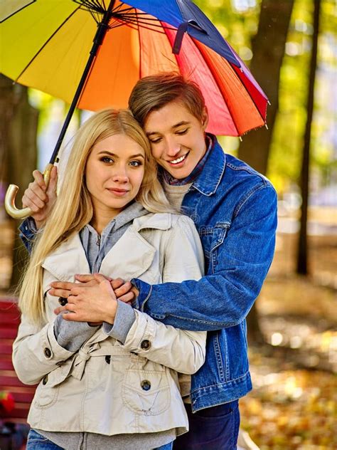 Loving Couple On A Date Under Umbrella Stock Photo Image Of Passion