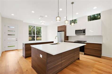 Honestly, if you build supportive frames (as opposed to simply hanging them and using the cheap little legs) underneath the carcasses, as well as a few other things, they seem to hold up a lot better. Modern walnut and white kitchen with Ikea cabinets. # ...