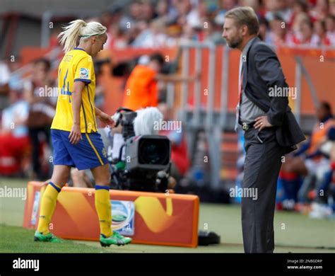 Swedens Josefine Oqvist Walks Off The Pitch And Past Sweden Team Coach Thomas Dennerby After