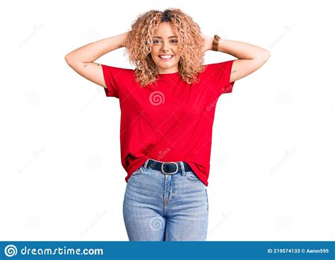 Young Blonde Woman With Curly Hair Wearing Casual Red Tshirt Relaxing