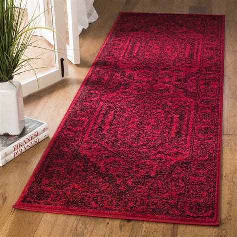 Safaviehu0027s adirondack collection is inspired by timeless vintage designs crafted with the softest polypropylene available. Adirondack Collection 2'-6" X 8' Rug in Red And Black ...