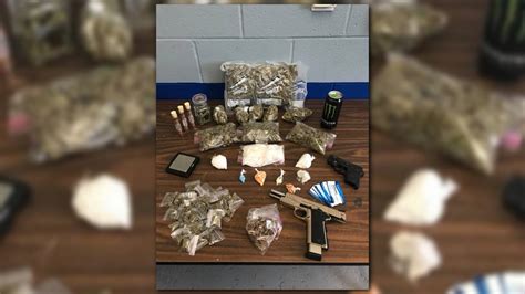 2 Charged After Drugs Weapons Found In Louisville Home