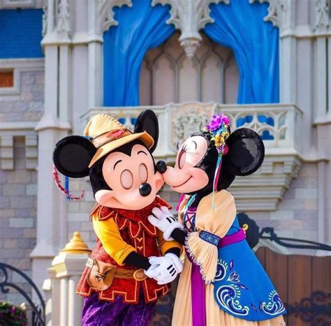 Mickey Getting A Kiss From Minnie While They Perform In Mickeys