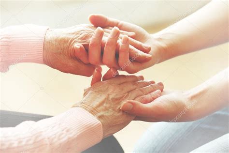 Helping Hands Care For The Elderly Concept — Stock Photo © Belchonock