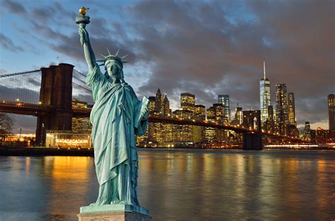 Brooklyn Bridge At Night And Statue Of Liberty Stock Photo Download