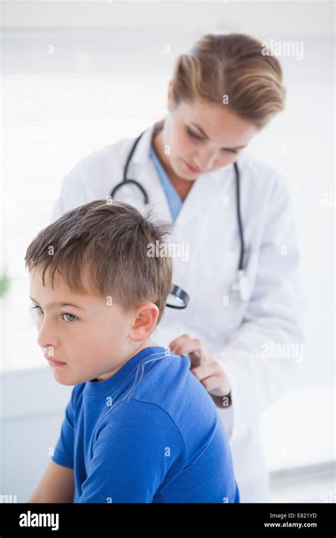 Doctor Examining A Patients Neck Stock Photo Alamy