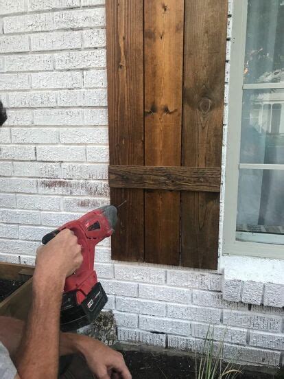 I have a thing for old shutters. How to Hang Wood Shutters on Brick DIY | Wood shutters ...
