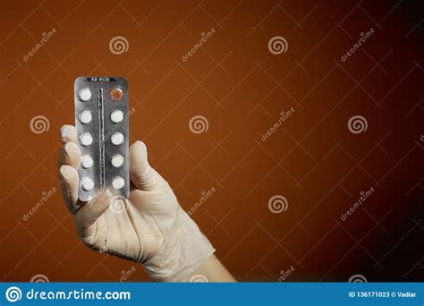 Woman Holding A Pill In Her Hand Treatment Of Colds Stock Image