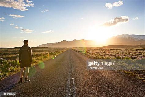 Man Walking Sunset Photos And Premium High Res Pictures Getty Images