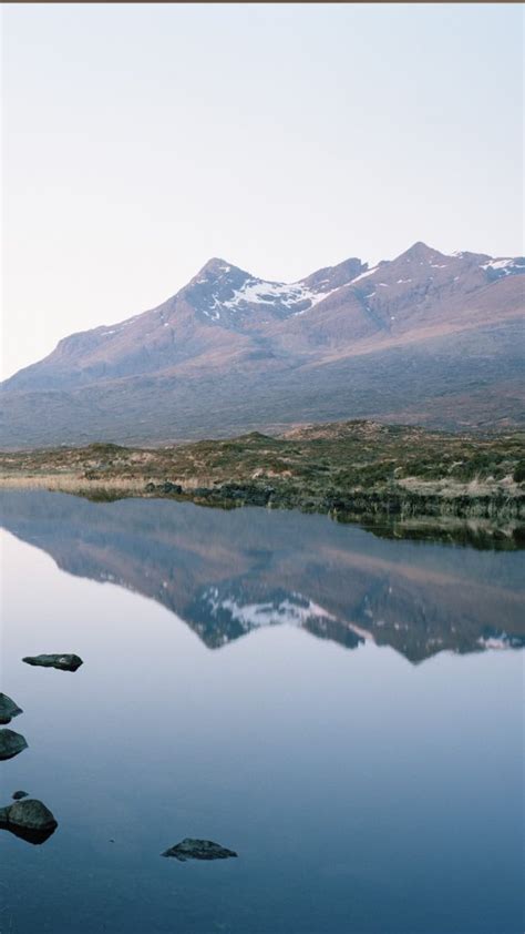 Cuillin Mountain Range Reflected In A Loch At Sunset Isle Of Skye