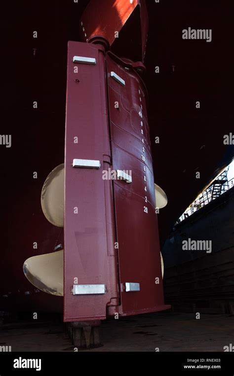 View Of Ship Propeller And Rudder In A Dry Dock Background
