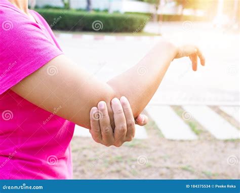 Asian Women Use Hand Touching On Arms Due To Pain In Elbows And Shoulders With Muscle