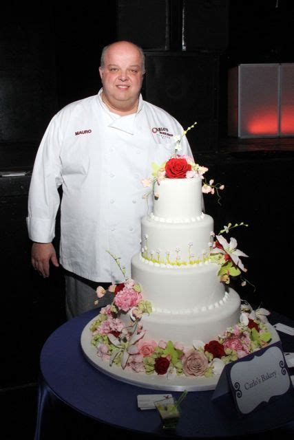 Mauro From Cake Boss Displaying A Wedding Cake From Carlos Bakery At