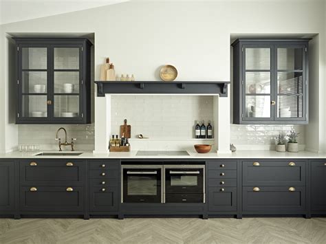 Dark Shaker Kitchen With White Worktops And Brass Hardware Modern