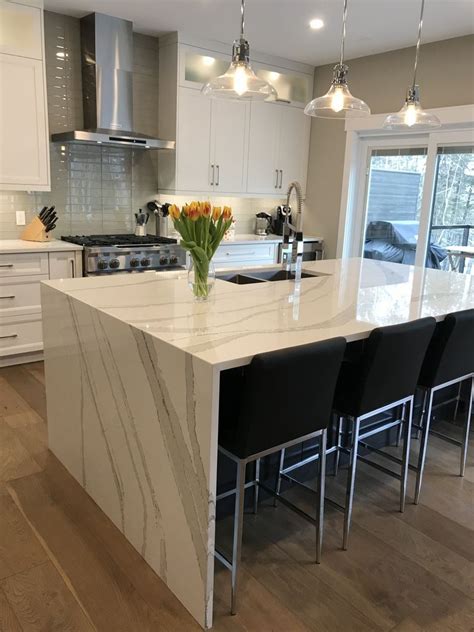 This kitchen was designed for efficiency, openness and family interaction. Cambria Brittanica Quartz Waterfall Island by Bella Marble ...