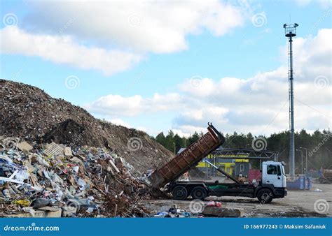 Garbage Truck Unloads Construction Waste From Container At The Landfill