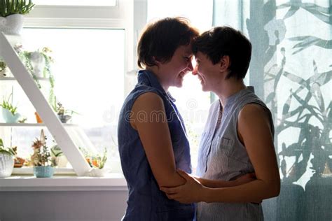Same Sex Female Couple Taking A Selfie In Their Home Stock Image