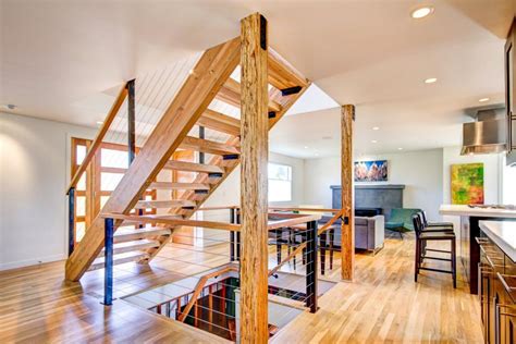 Bright Open Plan Living Space With Floating Wood Staircase Hgtv