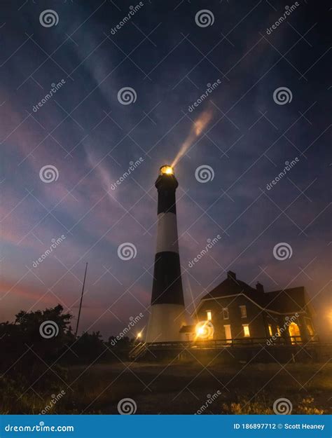 Beam Of Light From A Lighthouse Beacon Dramatic Cloudy Foggy