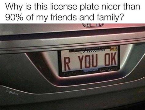 the front end of a silver honda car at night with its license plate showing r you ok