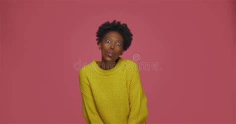 Playful African American Young Woman Show Funny Faces Gesturing Grimace With Tongue And Hands