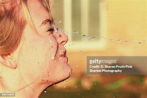 Squirting Girl Stockfotos En Beelden Getty Images