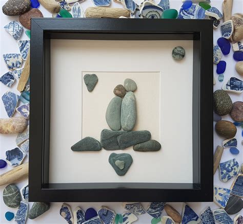 Check out this pebble art, pebble picture of couple kissing on rocks ...