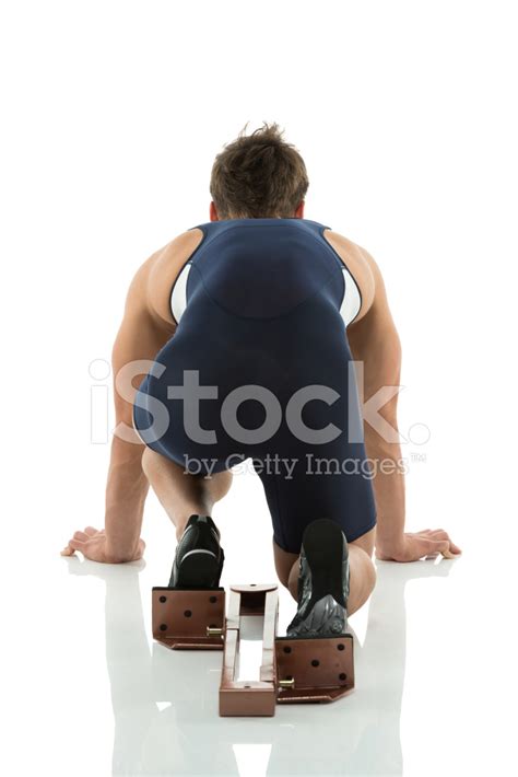 Rear View Of Athlete In Starting Block Stock Photo Royalty Free