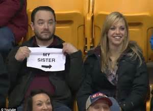 Man Behind Hilarious My Sister Kiss Cam Sign Reveals How He Warned Sister Daily Mail Online