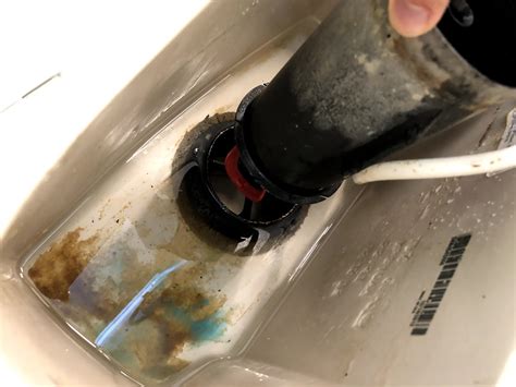 Immediately identify the old, worn red valve seal at bottom of the vertical assembly of overflow tube and flush valve seals will need to be replaced, at least, once every few years, depending on water condition. water - Repair sealing inside toilet tank that leads to ...