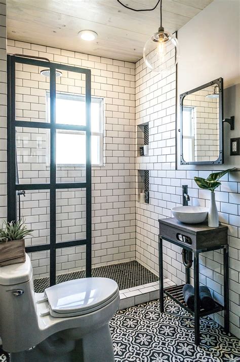 This bathroom takes it a step further by continuing a black and white striped tile pattern from the walls into the shower. 31 Small Bathroom Design Ideas To Get Inspired