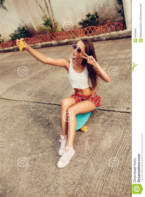 Beautiful Young Lady In Erotic Mini Skirt With A Skateboard Stock Image
