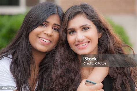 Two Young Sisters Of South Asian Ethnicity Stock Photo Download Image