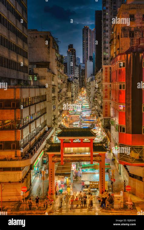 The Temple Street Market Illuminated At Night In Kowloon Hong Kong