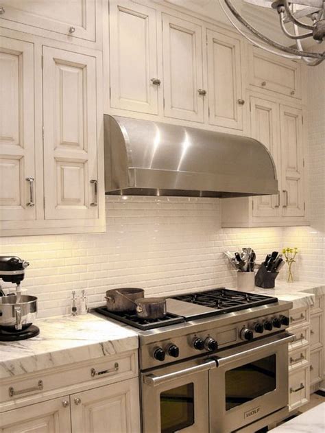 White gloss 2x4 staggered bevel mosaic tile is a white, ceramic tile that can add the perfect touch to your space. 35 Beautiful Kitchen Backsplash Ideas - Hative