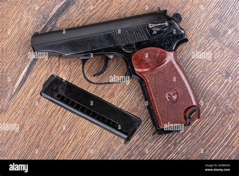 Top View Of The Makarov Pistol And The Magazine For The Cartridge On A