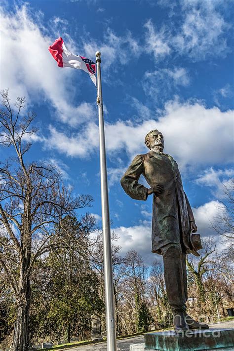Jefferson Davis Beneath Confederate Flag Blowing In The Strong Wind