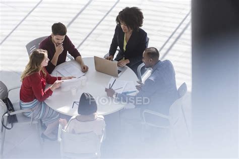 Business People Planning Meeting At Table In Office — Convenience