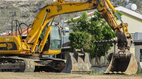 Free Images Asphalt Vehicle Yellow Bulldozer Crane Excavator