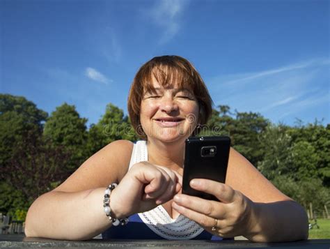 Mature Woman Texting On Mobile Stock Image Image Of Mobile Mature 33411675