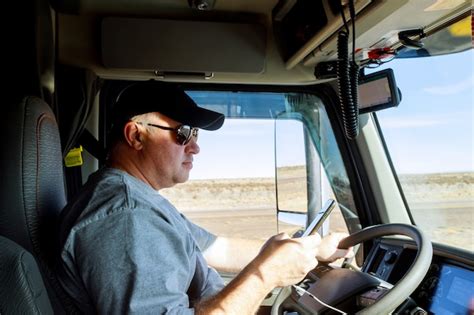 Premium Photo Truck Drivers Big Truck Drivers In Cabin Of Big Modern