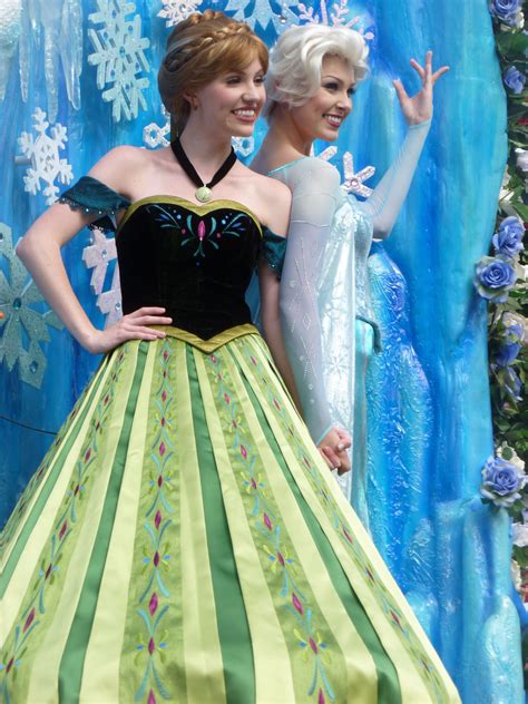 elsa and anna in the festival of fantasy parade small world vacations disney vacations