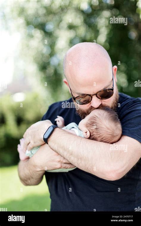 Father Kissing Baby Stock Photo Alamy