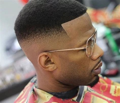 This cool cut for black hair extends the hairline into an arced part that also divides long hair from short. Here are the Top 10 trendy haircuts for Guys - the Afro ...